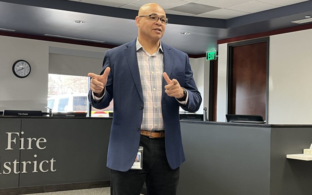 Marcus Johnson talking through presentation in a conference room
